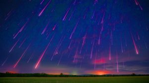 Illustration of the Perseid meteor shower lighting up the August night sky.