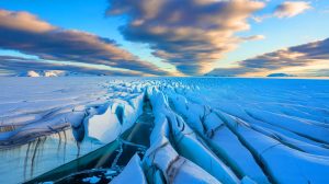 Illustration of atmospheric rivers impacting the Antarctic ice sheet, accelerating ice melt and contributing to sea level rise, generated by artificial intelligence.