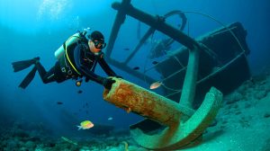 Illustration of divers uncovering a remarkably intact 2,500-year-old shipwreck off the coast of Sicily.